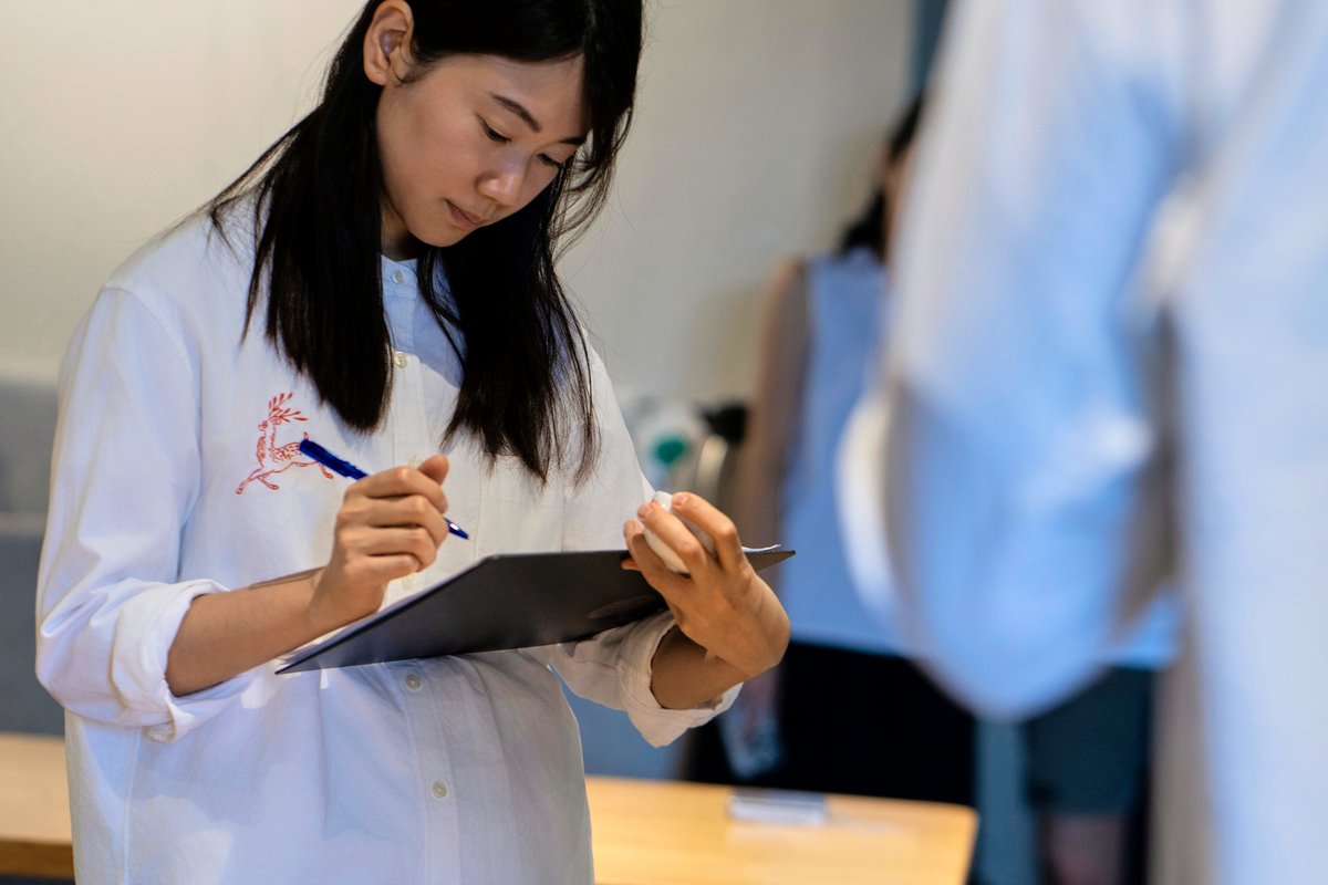 Team members taking note on the results of tasting.