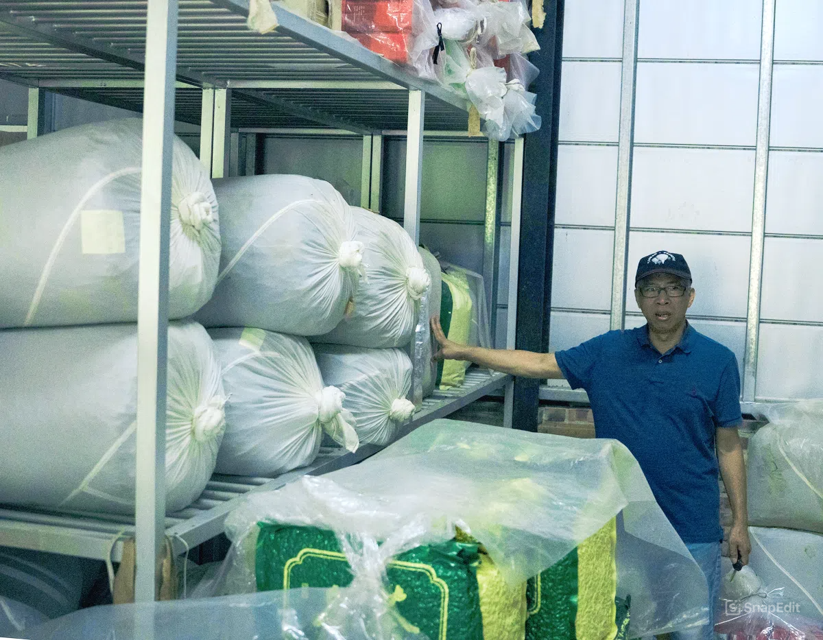 Yiping Tea Garden's owner in his storage warehouse.