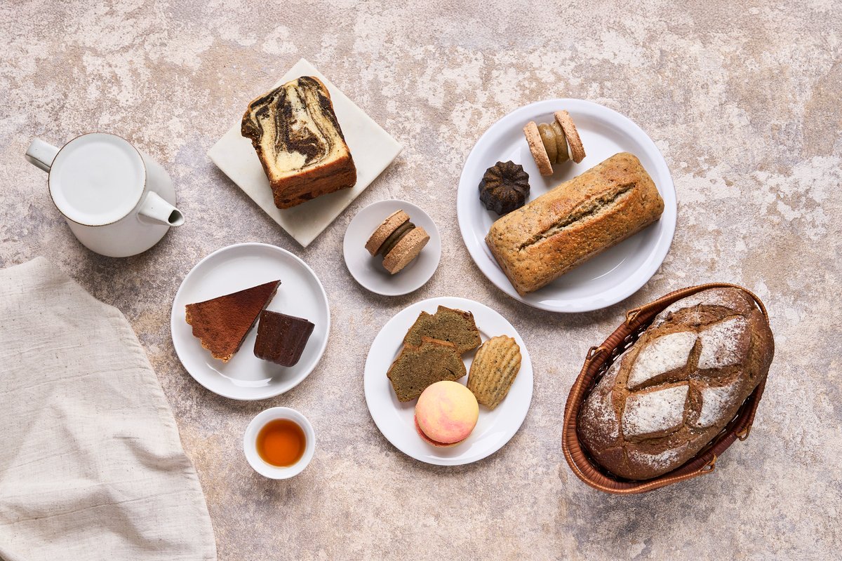 A display of various desserts and breads made from Hsuan Mao's tea powder.