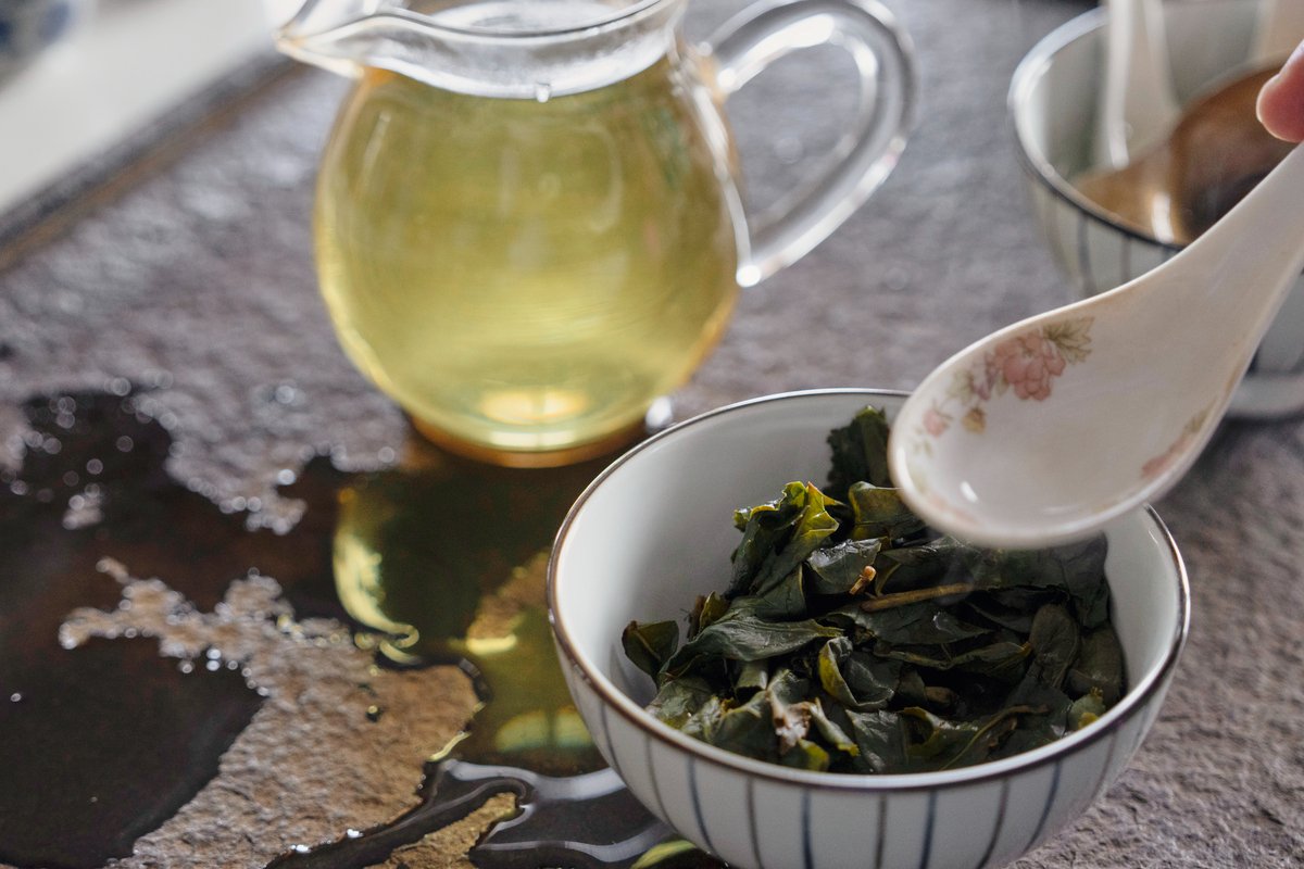 A close-up photo of a pot of light color oolong tea.