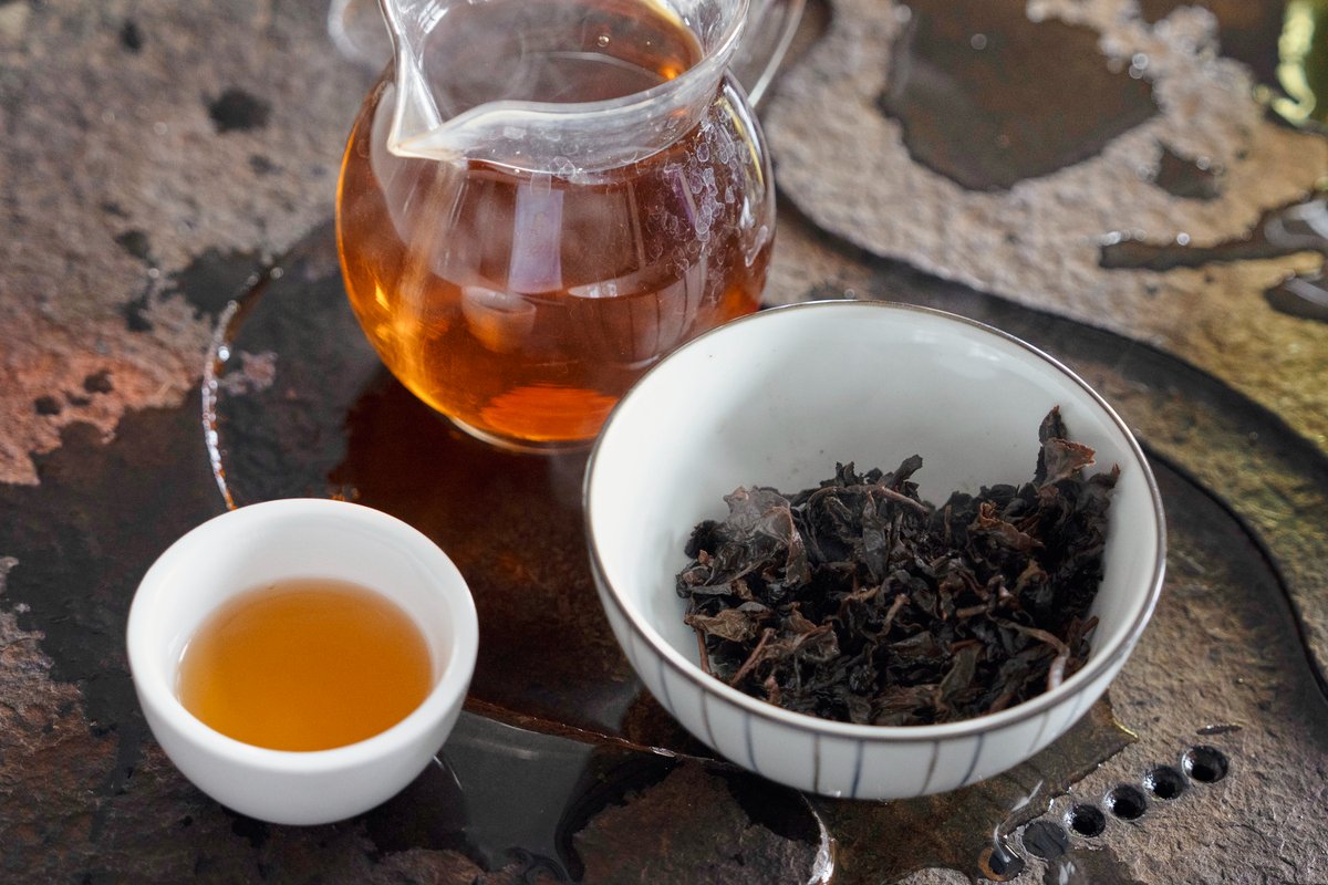 A close-up photo of a pot of darker color oolong tea.