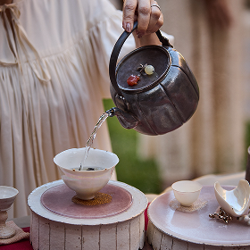 Water being poured out from a teapot.